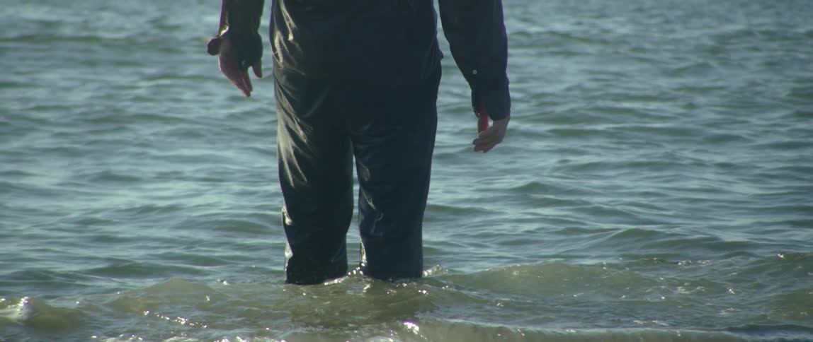 Couple On The Beach And In The Ocean