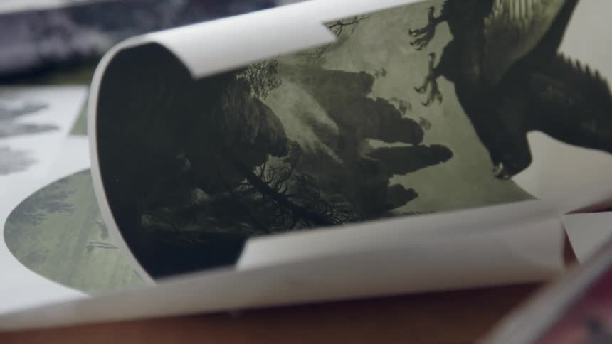 A paper rolling on table
