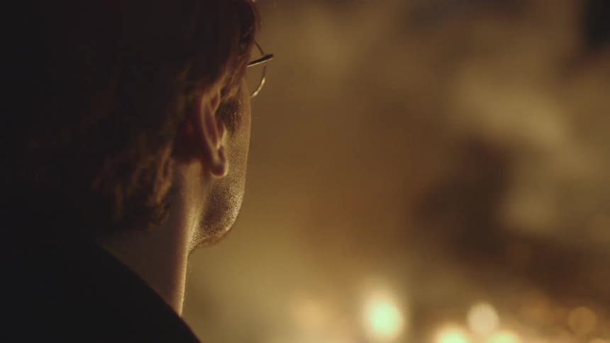 A man is watching a fire
