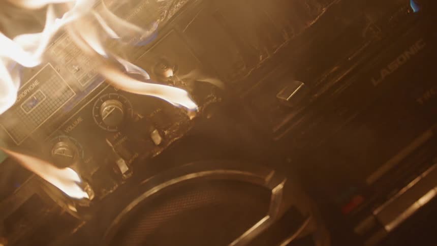 Fire burns over electronics and smokes