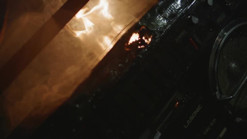 The oven is giving off fire and smoke