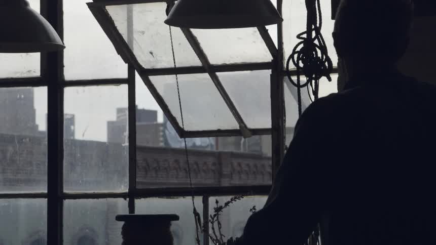 A person sitting by a window