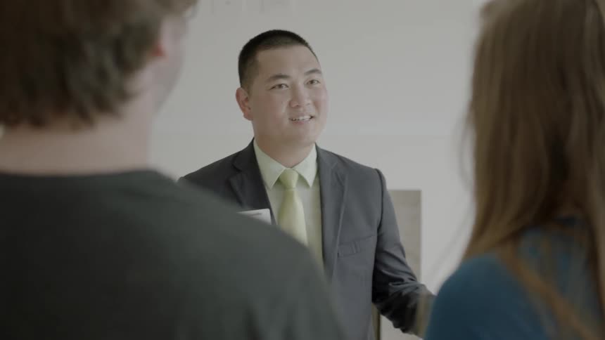 Greeter talks to a couple