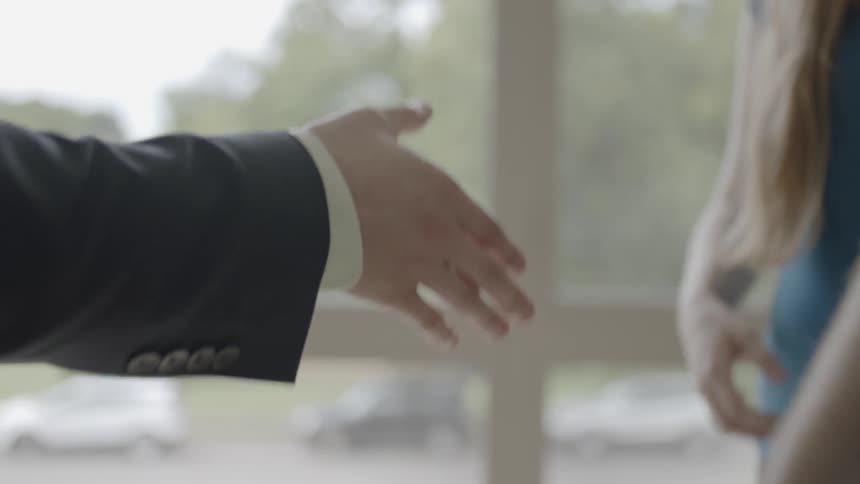People shaking hands indoor