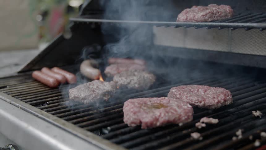 Meat smoking and cooking on a grill