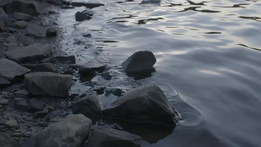 Rocks sitting in water