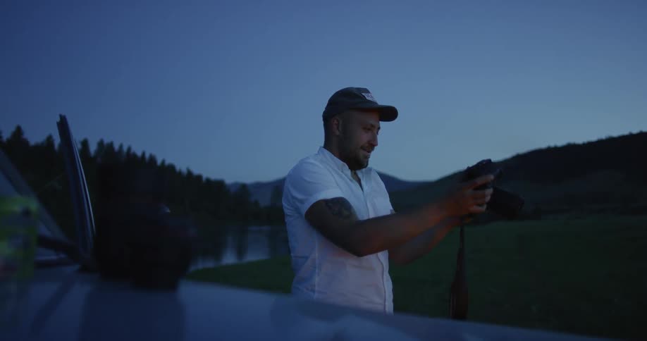 Man takes a picture at night