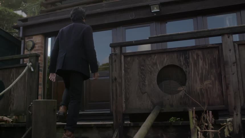 A man is walking up the steps