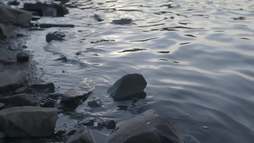 Water is shown over rocks