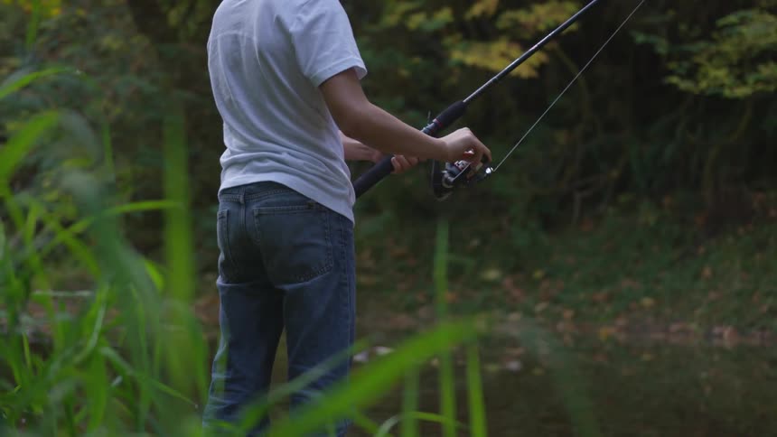 Man fishing by lake