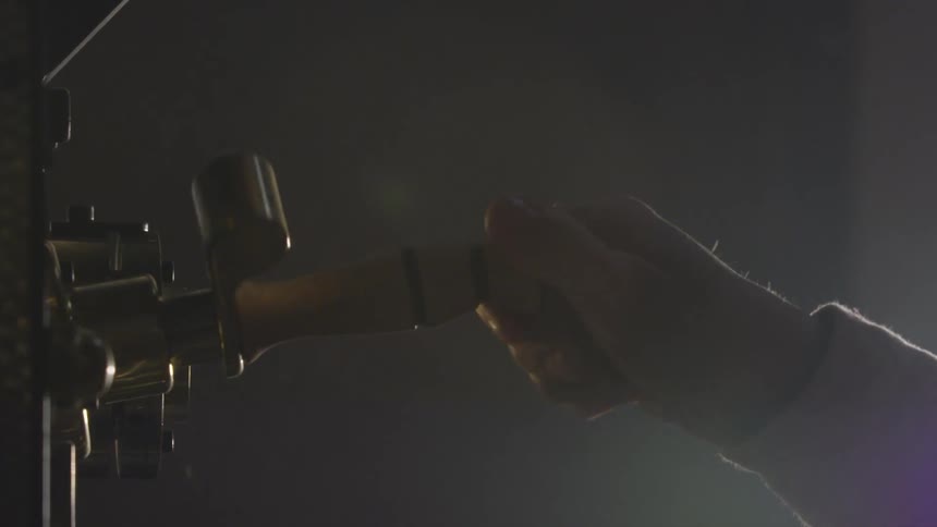 A hand twist and pull something out