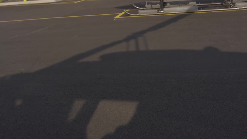 The shadow of a helicopter and the propellor