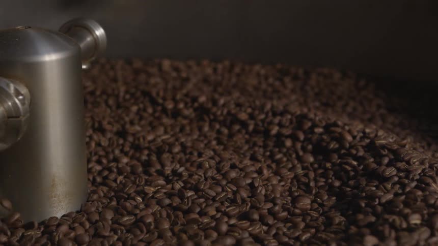 Coffee beans spinning in a roaster