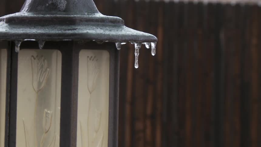 Tiny icicles hanging from a swaying lantern