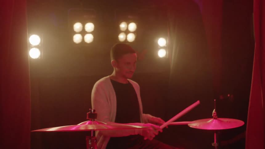 Man plays drums
