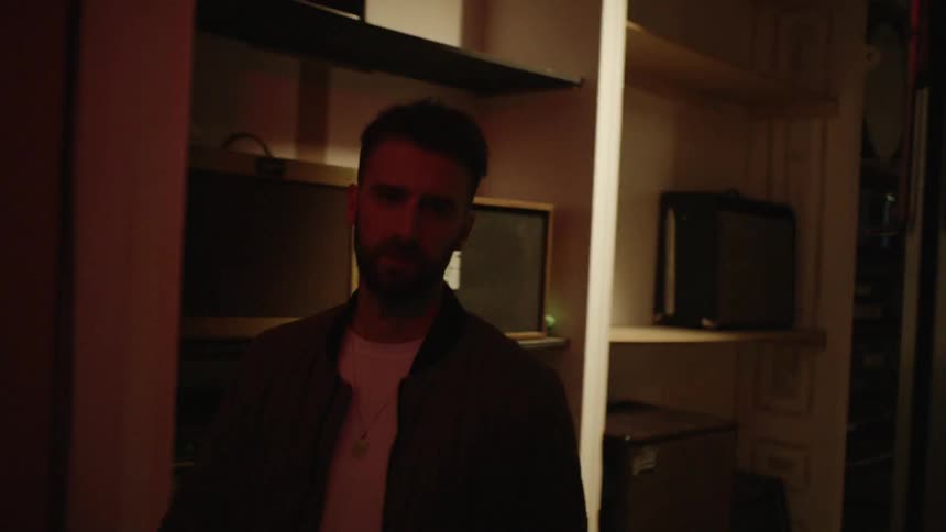 A man is walking through a house