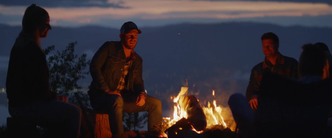People talk around the campfire