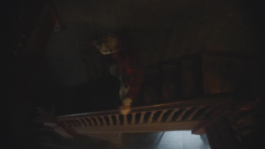 A man rushing down the stairs