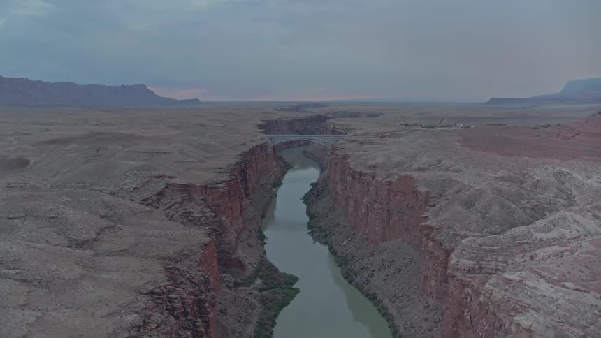 A river flows through a canyon in the wilderness