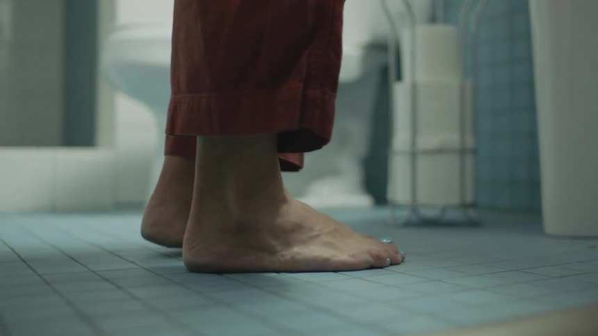 A person is standing in the restroom