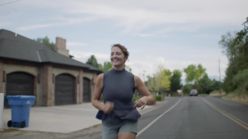 Woman jogs down the street