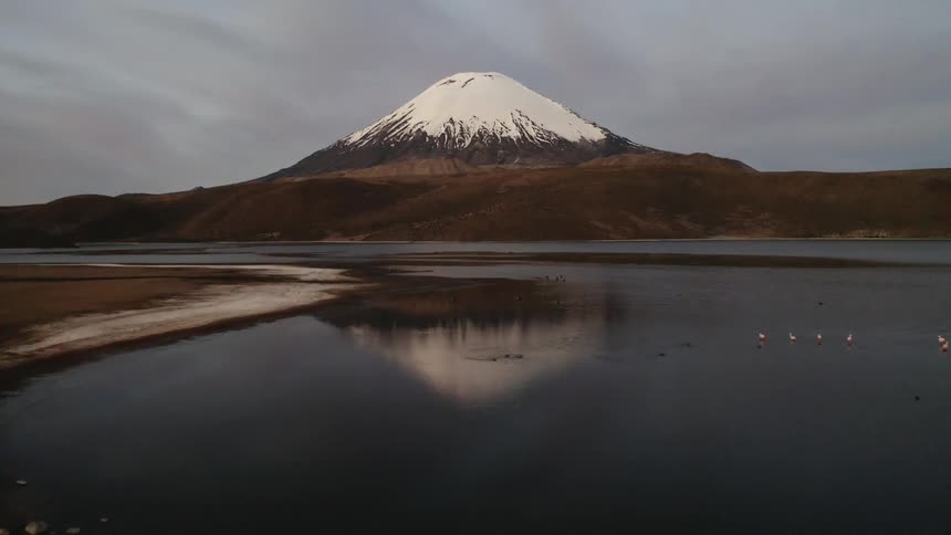 The mountain top is covered with snow