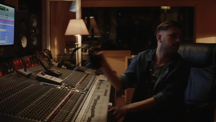 People are working in a music studio