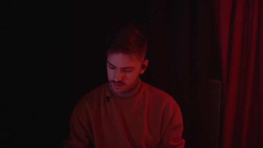 A man is playing on a piano