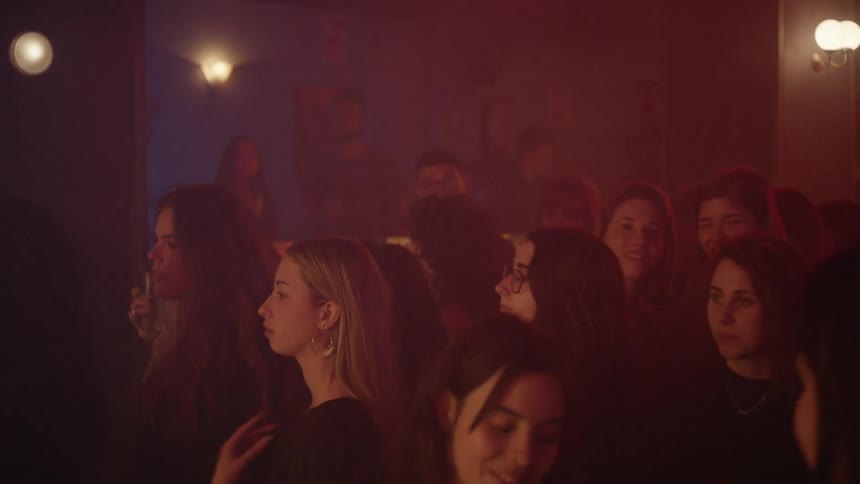 The club is full of people dancing