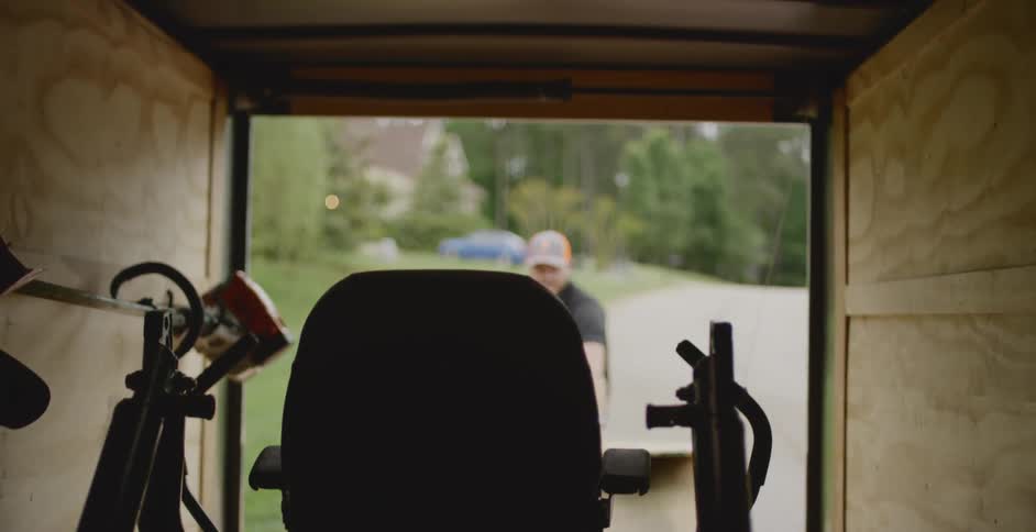 A man opens a trunk door