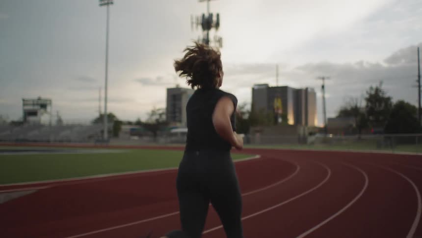 A person is running on a track