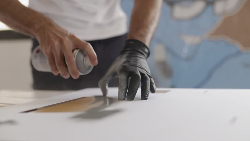 A man is spray painting