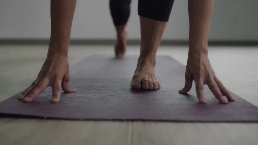 A woman is doing yoga in the building