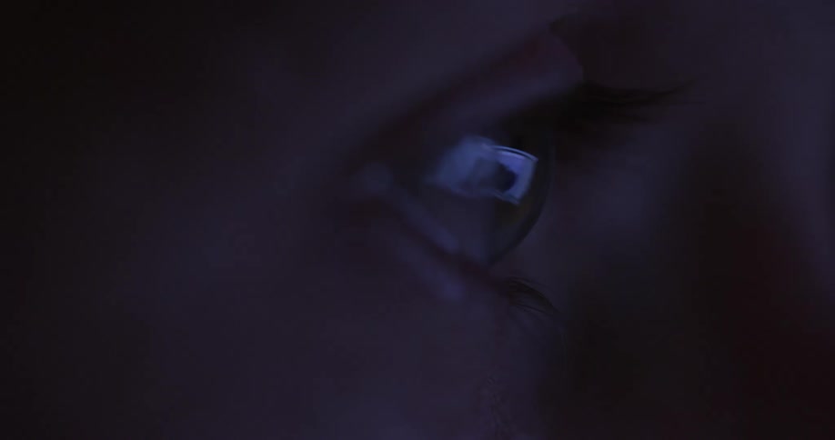 Flashing images are reflected in an eye