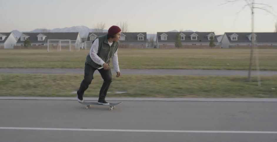 Skateboarder grinds on two benches before kickflipping