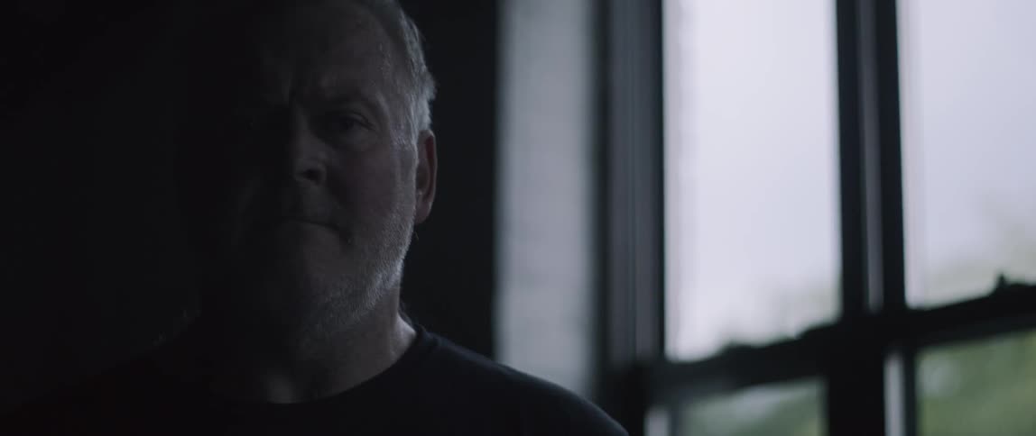 A man is looking around indoors