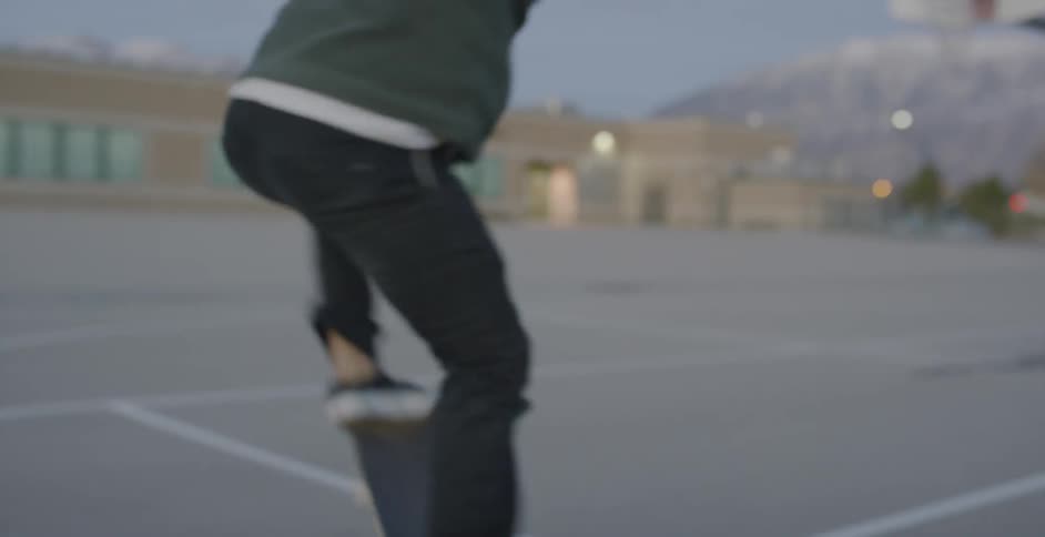 Man Skateboarding Around City