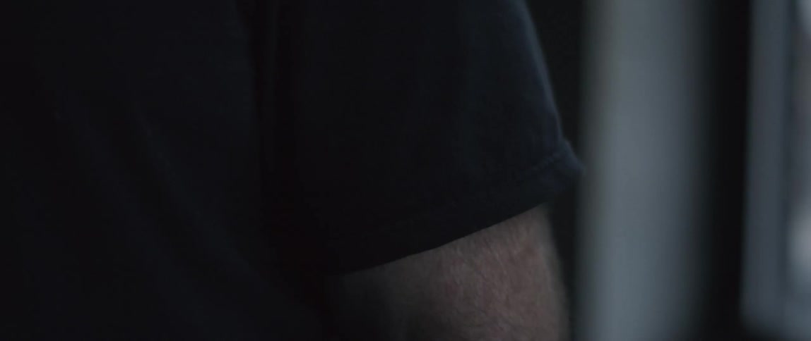 Closeup of man's arm tensing slightly