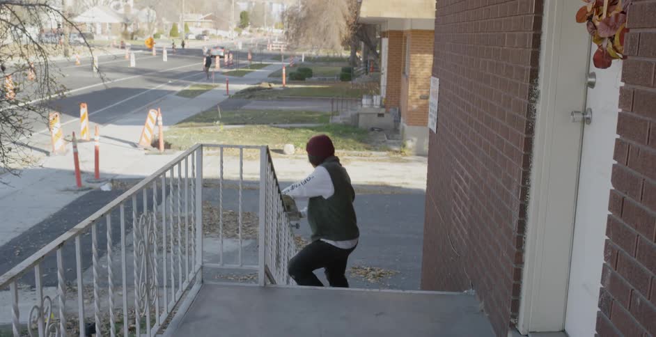 Man Skateboarding Around City