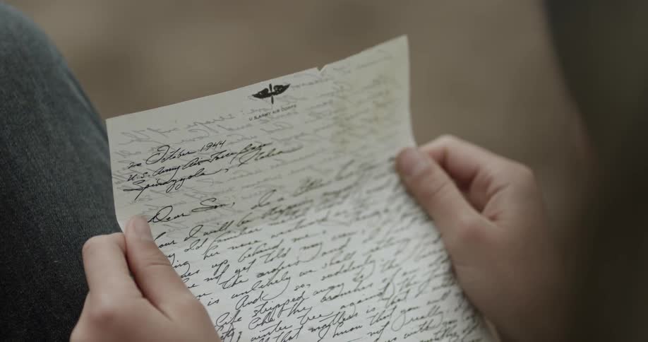 A person reading a letter