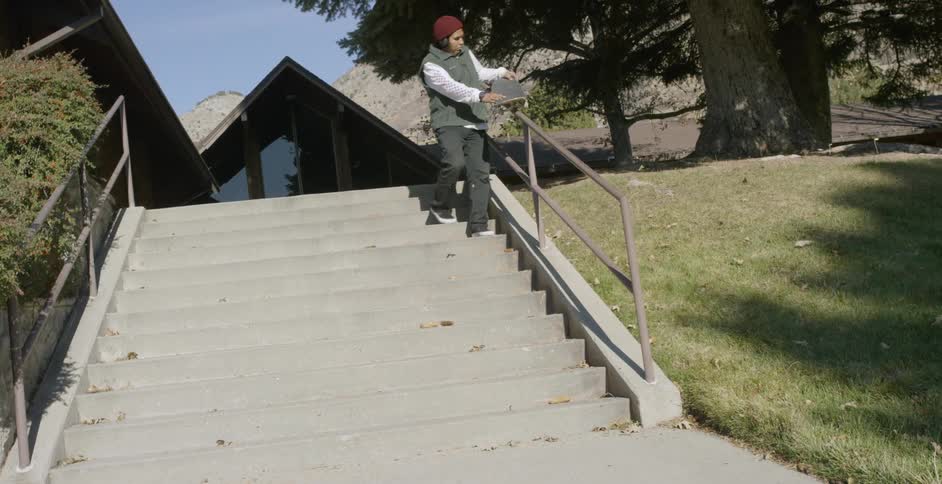Man Skateboarding Around City