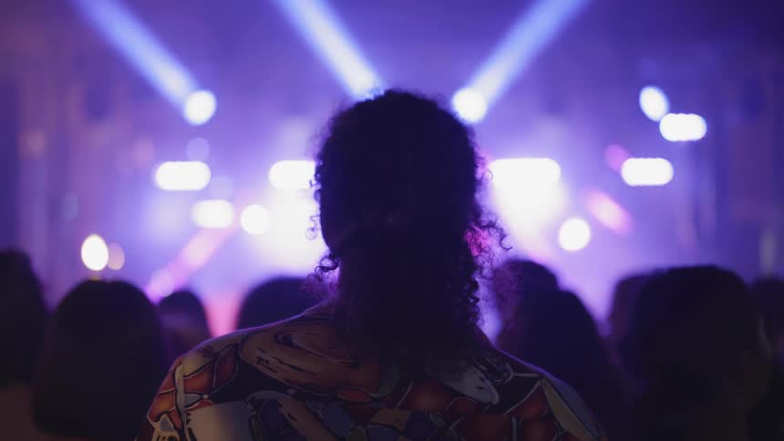 People watch a performance on stage