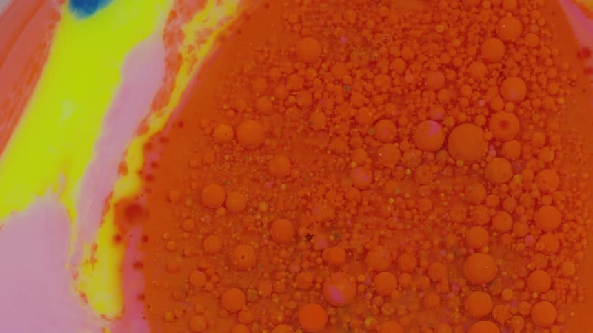 Colorful oil bubbles mixing together