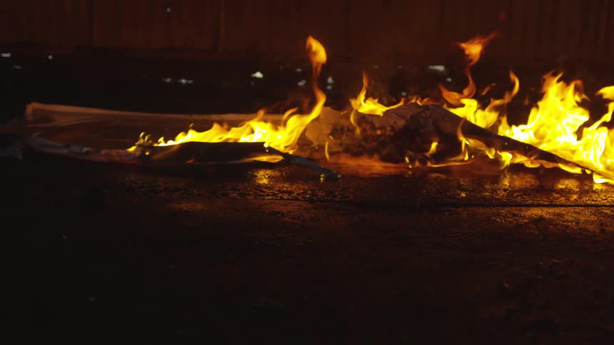 Abstract People Burning Various Objects In Warehouse