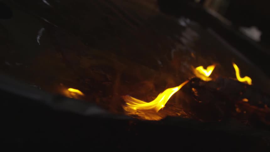 Abstract People Burning Various Objects In Warehouse