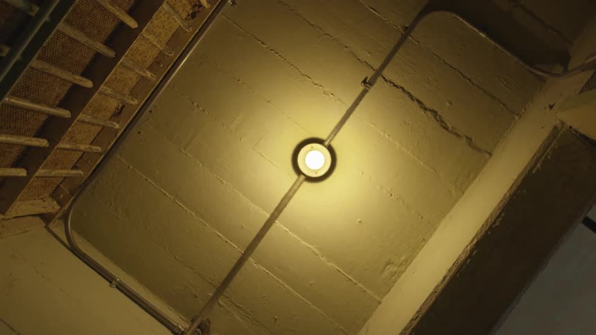 The ceiling and light bulb of a small room
