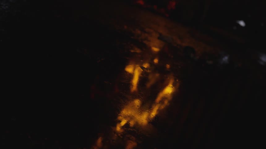 A fire is raging at night