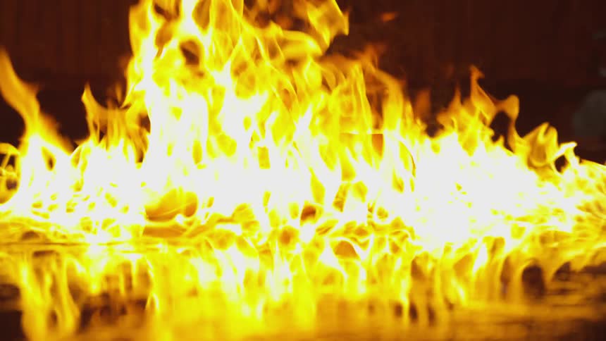 Abstract People Burning Various Objects In Warehouse