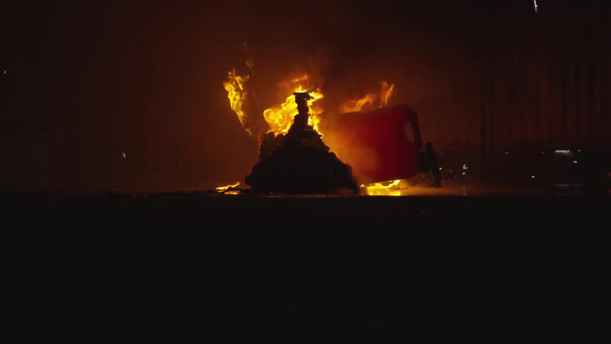 Abstract People Burning Various Objects In Warehouse