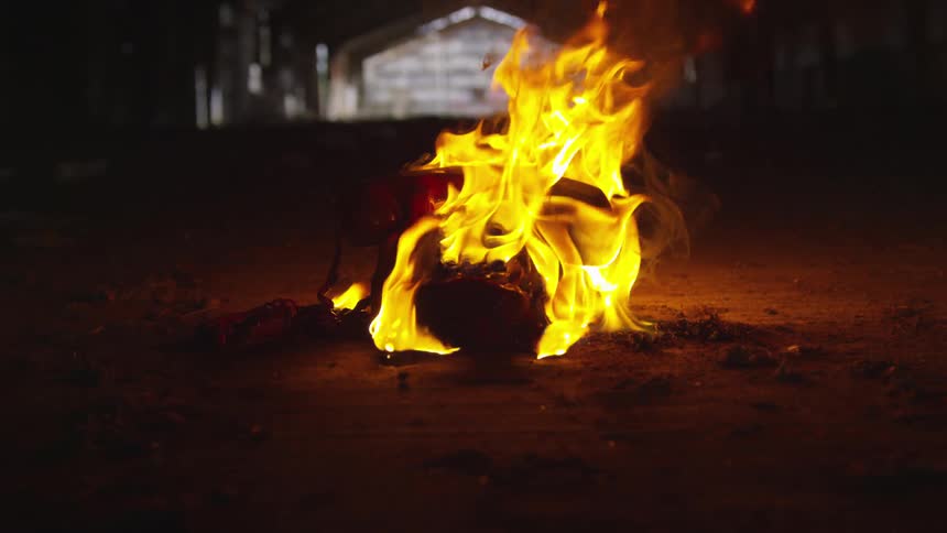 Abstract People Burning Various Objects In Warehouse